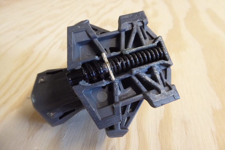 Flex compensation spring is stiffer, to help with movement of the binding while touring. It's also got a subtle change in a small metal stop that appears to be larger and perhaps more reliable.