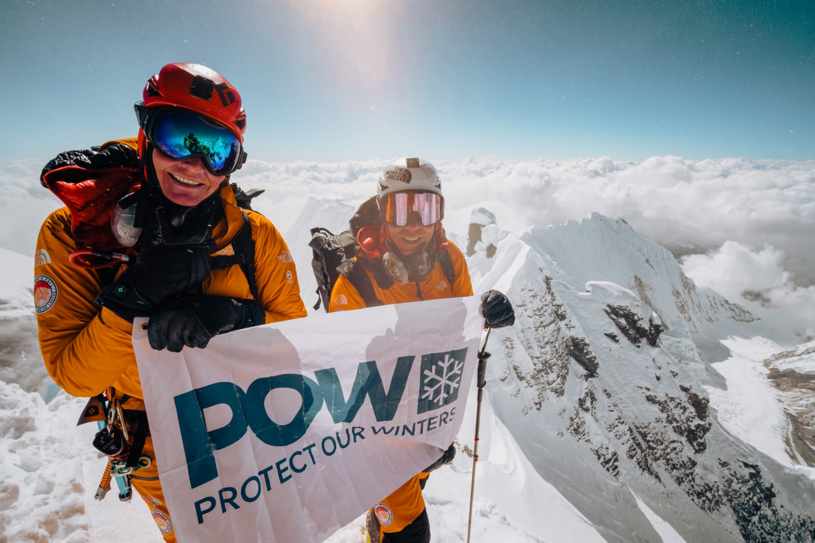 Hilaree Nelson and Jim Morrison standing stop Lhotse Peak in 2018 before completing the first ski descent of the coveted Lhotse Couloir.
