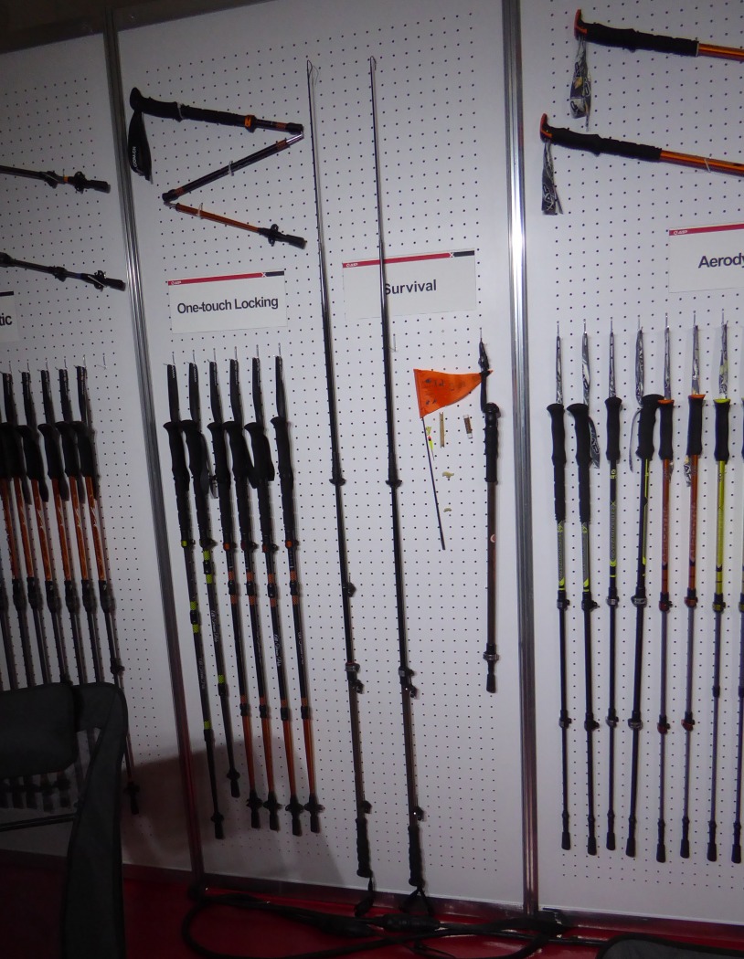 The "Survival Pole." Trekking pole extends to a fishing rod. Inside, find a small rolled-up signal flag, fish hooks and universal lure, string, wood saw, Grip is topped with a compass, the wrist strap holds has a fire sparker and whistle. Don't pole without it!