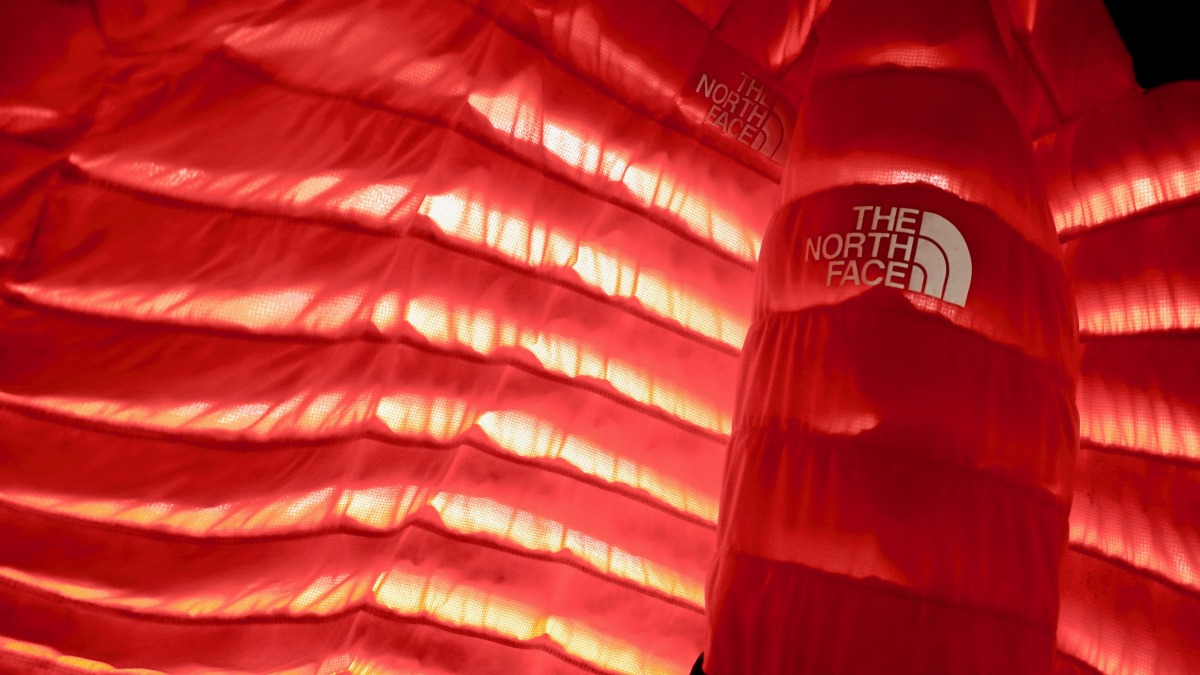 The 50/50 is so named for the equal distribution of down and a polyester nylon blend. Permeability is illustrated by the light filtering through.