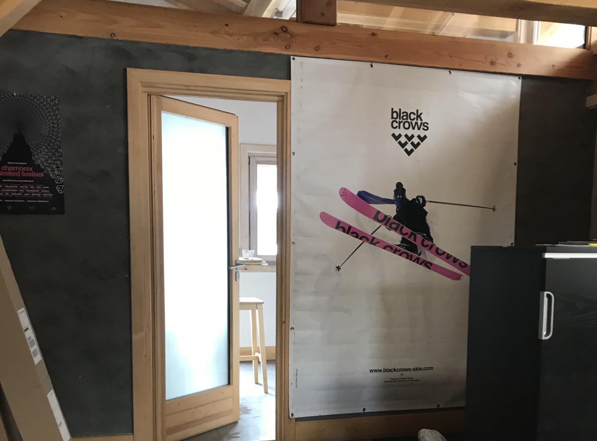 My true indication I was in the right place: a wall-sized poster of the iconic pink bottomed Corvus ski.