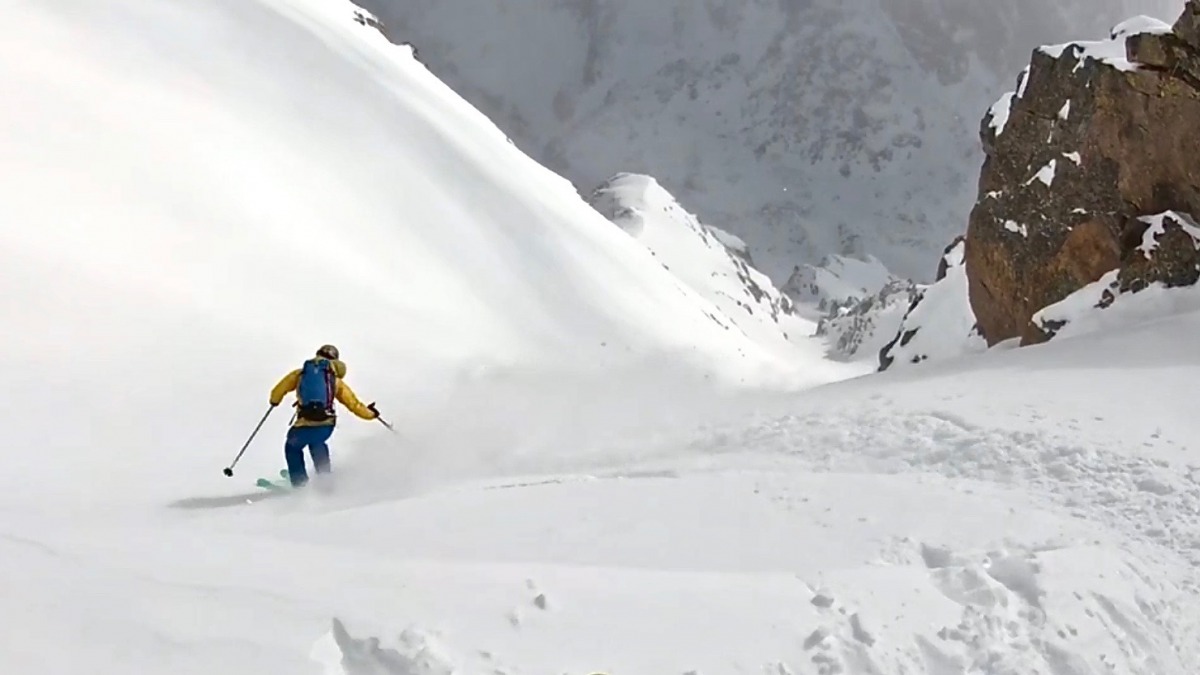 Dropping in to the Holy Cross Couloir last spring. Ski bases gliding with Mountain Flow on cold powder up top to corn on the apron.