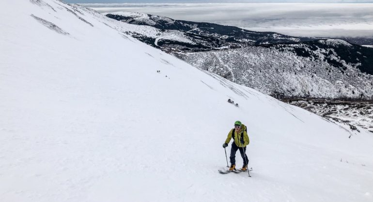 The SLAYr makes a 114mm underfoot ski with a skimo pack seem not so crazy...Photo by Eric Dahl