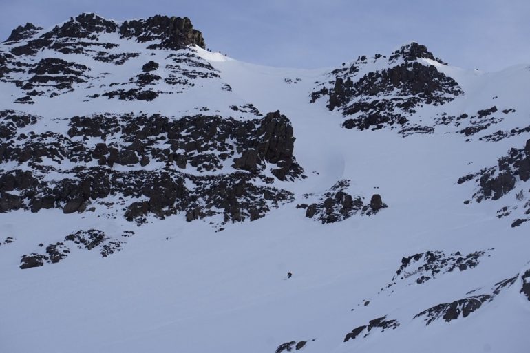 Full view of Hourglass couloir, Connor catching the funner turns in the apron.