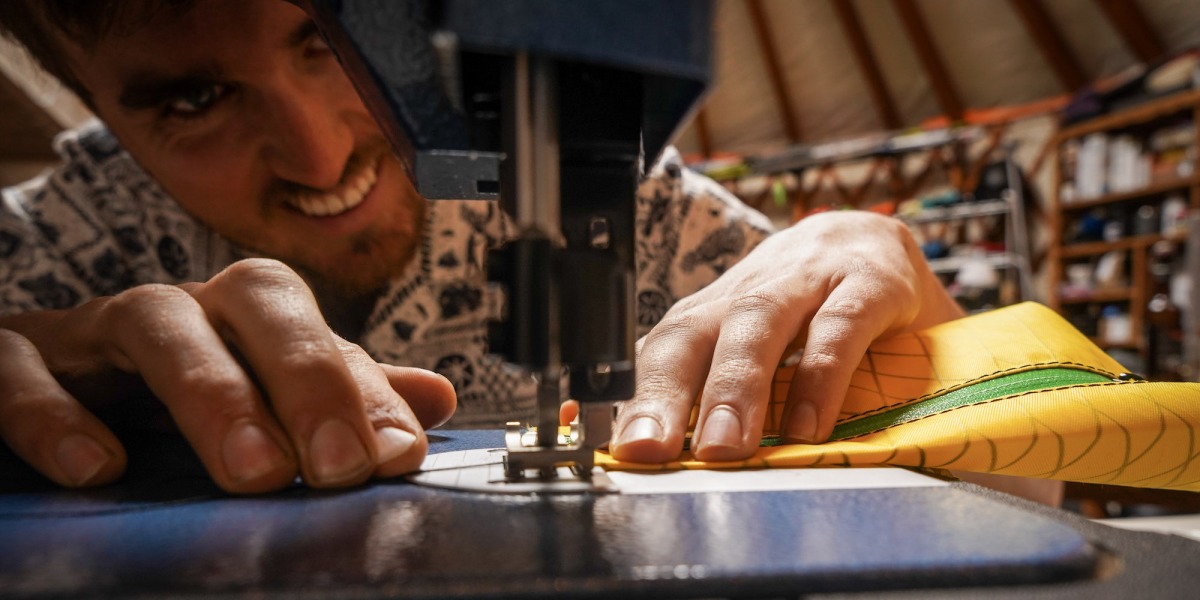 It is a long and methodical process to work with high performance fabrics. Include the custom requests and personalized colors - Gavin has his hands full with pack orders.
