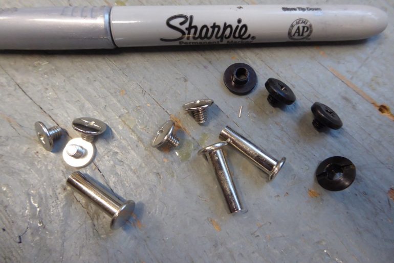 Screw rivets, i.e., chicago screws, the boot modder's friend.