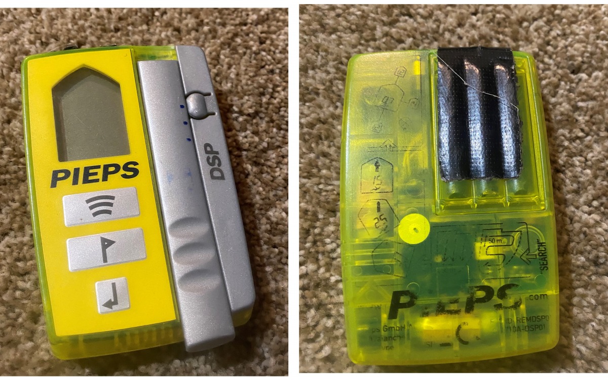 A well used Pieps beacon, most of the writing on the front and back has been worn off. If the duct tape didn't give it away, this beacon would be a good candidate for a spare beacon or one to be donated to snow science.