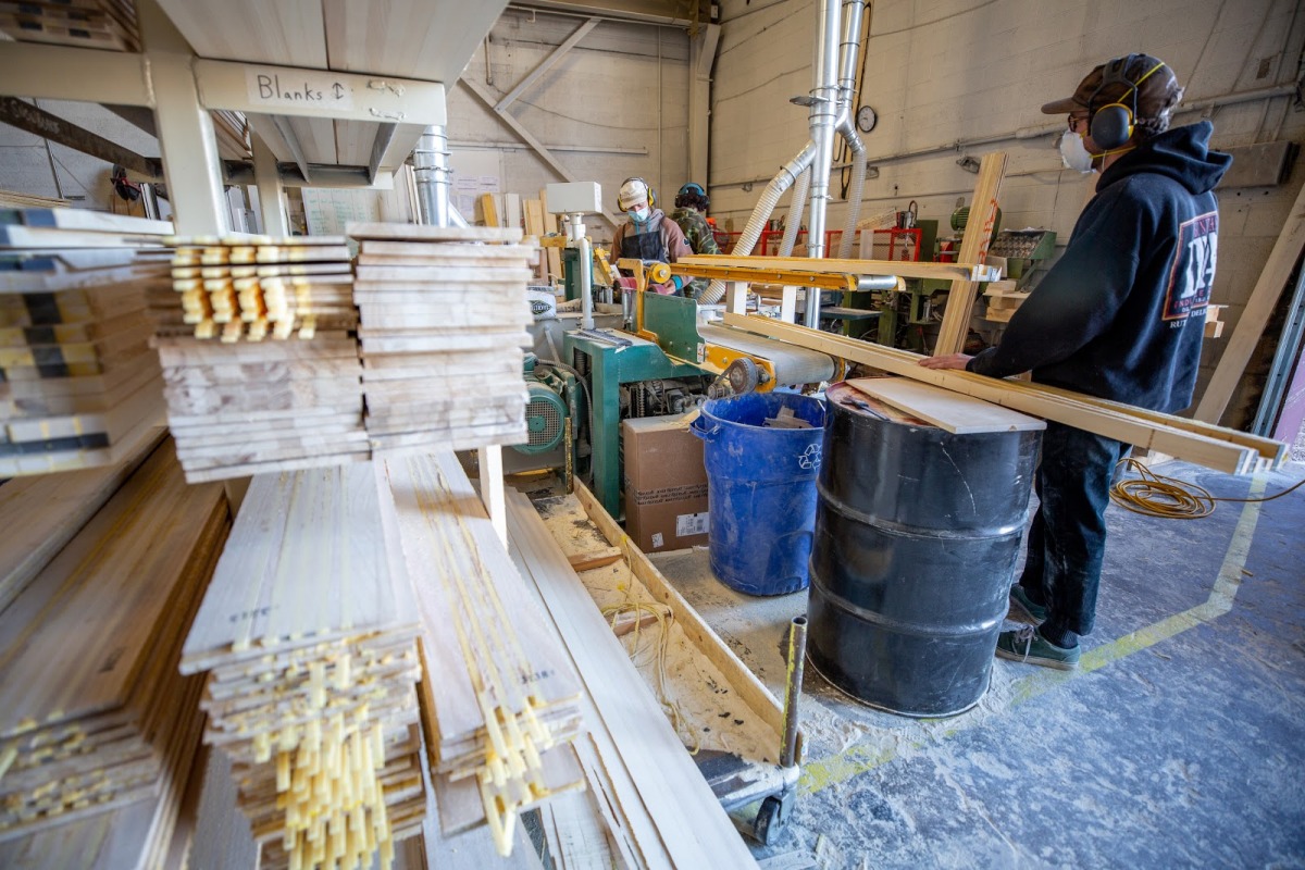 The first room of the construction process is the core room. Wood and foam are laminated and layered into blanks. The blanks get cut in a 3D CNC mill to get their shape, profile, and pour-in sidewall.