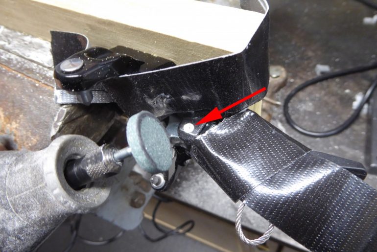 Step 2, grind the head of the lock lever pivot pin.