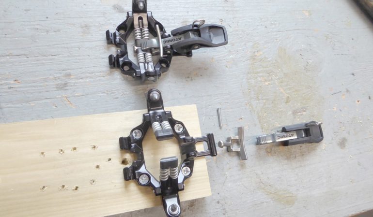 Step 7, remove the lock lever and boot toe locator stop.