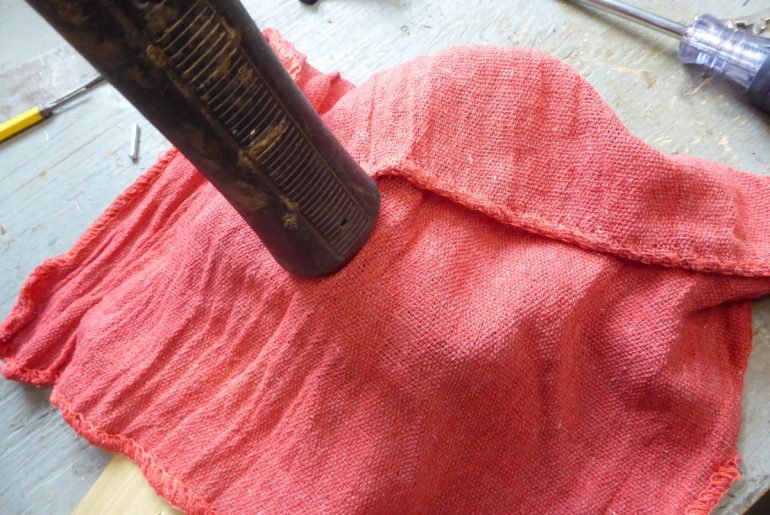 With the binding assembled, and in the open mode, cover again and press down the center until it pops into the closed (on boot) position.