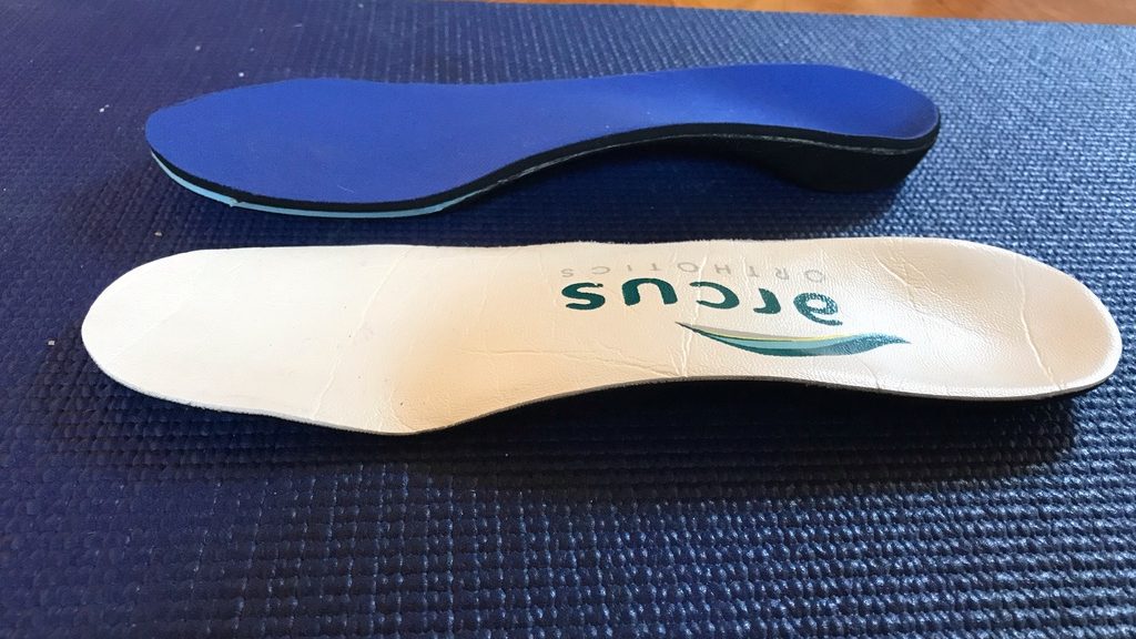 The first orthotic I received (blue) was too high volume to be worn in my ski boots. The second one (white) was much thinner but still provided decent support and alignment.
