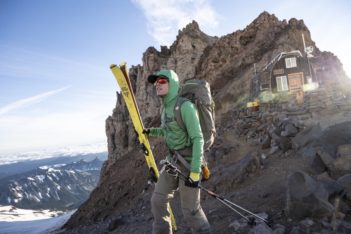 Trevor Kostanich carries his skis across the rocky ridge in front of Camp Schurman below the prominent rocks of Steamboat Prow. This point was reached at approximately 6am on day one, 5 hours after leaving the Glacier Basin trailhead near the White River campground. Camp Schruman is located at 9400’ on the NE side of Mount Rainier, and serves as the jumping off point for the Emmons / Winthrop climbing route.