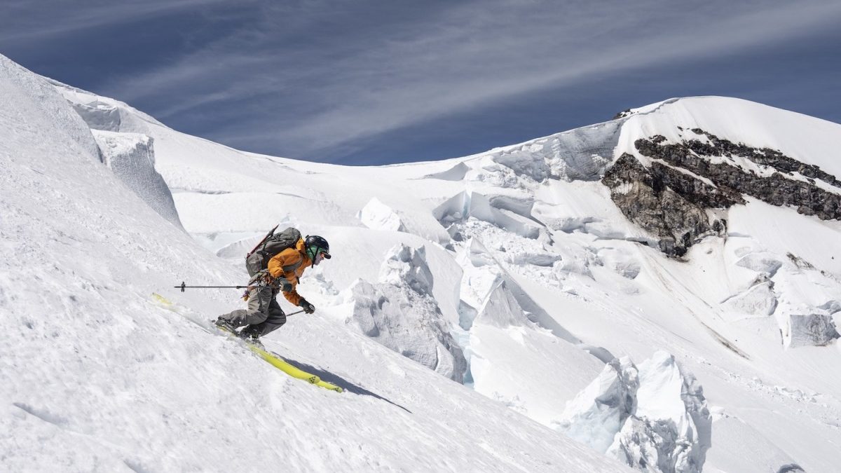Trevor Kostanich skiing the Emmons glacier with the glacial formations of the Winthrop Glacier and Russell Cliff in the background. This skiing was captured at around 12,000’, a point at which the snow quality was excellent and the glacier was well covered. Nearly continuous skiing on this route was found from the summit all the way to Glacier Basin, a nearly 8,500’ ski run.